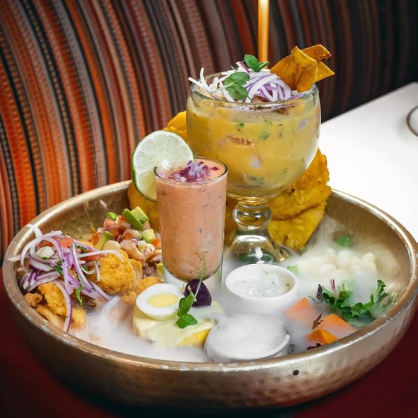 Aromas del Peru's ceviche platter with various seafood, sauces, and garnishes, emitting a smoky effect.